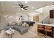 Spacious living room featuring a pool table, comfortable seating, and a modern bar area at 4817 E Cielo Grande Ave, Phoenix, AZ 85054