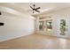 Bright room with tile floor and a glass patio door provides outdoor access and natural light at 4817 E Cielo Grande Ave, Phoenix, AZ 85054
