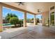 Covered patio with concrete floors, view of the pool and backyard at 4817 E Cielo Grande Ave, Phoenix, AZ 85054