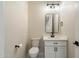 Modern powder room with stylish fixtures, vanity, and sleek black hardware at 4817 E Cielo Grande Ave, Phoenix, AZ 85054