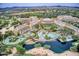 Aerial shot of a resort pool area featuring a lazy river and lush landscaping with hotel in the background at 4817 E Cielo Grande Ave, Phoenix, AZ 85054