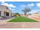 Expansive backyard showcasing artificial turf, play area, and an outdoor seating area at 5320 W Fawn Dr, Laveen, AZ 85339