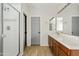 Bathroom with a walk-in shower, dual sinks, and wood-look flooring at 5320 W Fawn Dr, Laveen, AZ 85339