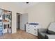 Inviting bedroom with closet, dresser with changing pad, Bedroom chair and plush carpet at 5320 W Fawn Dr, Laveen, AZ 85339