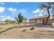 A view of the home with a walking path, desert landscaping and park/green space adjacent to the property at 5320 W Fawn Dr, Laveen, AZ 85339