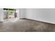 Bright bedroom with neutral carpet and sliding glass door to backyard patio at 5358 S Farmer Ave, Tempe, AZ 85283