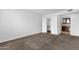 A clean bedroom featuring carpet floors, a closet and an adjacent bathroom for convenience at 5358 S Farmer Ave, Tempe, AZ 85283