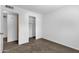A vacant bedroom shows a sliding-door closet with carpeted floors and neutral walls at 5358 S Farmer Ave, Tempe, AZ 85283