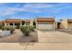 Exterior shot of home with red tile roof and desert landscaping and attached two car garage at 5358 S Farmer Ave, Tempe, AZ 85283