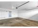 Spacious garage with concrete floors, white paneling, and storage or utility closet at 5358 S Farmer Ave, Tempe, AZ 85283