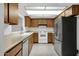 An eat-in kitchen with stainless steel refrigerator and dishwasher at 5358 S Farmer Ave, Tempe, AZ 85283