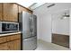 Kitchen area featuring stainless steel refrigerator and built-in microwave with matching wooden cabinets at 5358 S Farmer Ave, Tempe, AZ 85283