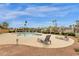 Community pool features ample deck space, chaise lounges, and beautiful desert landscaping at 5358 S Farmer Ave, Tempe, AZ 85283