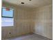 Unfinished bedroom with a window to let in natural light at 5551 S 240Th Ln, Buckeye, AZ 85326
