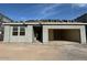 New single-story house under construction with a gray exterior at 5551 S 240Th Ln, Buckeye, AZ 85326