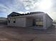 Rear exterior view showing a covered patio, a window and a partially finished roof at 5551 S 240Th Ln, Buckeye, AZ 85326