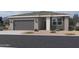 Charming single-story home with a two-car garage and desert landscaping at 5551 S 240Th Ln, Buckeye, AZ 85326