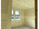Unfinished room with windows overlooking a landscaped area at 5551 S 240Th Ln, Buckeye, AZ 85326
