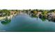 Waterfront homes on a canal, with boats docked along the shoreline at 5632 S Hurricane Ct # C, Tempe, AZ 85283