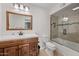 Bathroom with wood cabinets, glass-door shower and modern fixtures at 5632 S Hurricane Ct # C, Tempe, AZ 85283