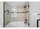 Well lit bathroom featuring a tub and shower combination, tiled walls, and glass enclosure at 5632 S Hurricane Ct # C, Tempe, AZ 85283