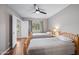 Inviting bedroom featuring two twin beds, wood floors, and a ceiling fan at 5632 S Hurricane Ct # C, Tempe, AZ 85283