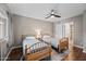 Comfortable bedroom with wood floors, ceiling fan, and two twin beds at 5632 S Hurricane Ct # C, Tempe, AZ 85283