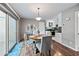 Cozy dining area with modern furnishings, hardwood floors, and a view of the kitchen at 5632 S Hurricane Ct # C, Tempe, AZ 85283