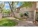 Charming home with a well-maintained exterior, mature trees, and a welcoming entrance at 5632 S Hurricane Ct # C, Tempe, AZ 85283