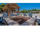 Community fire pit with stone border and Adirondack chairs for relaxing outdoors at 5632 S Hurricane Ct # C, Tempe, AZ 85283