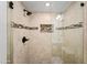 Walk-in shower with frameless glass door and tiled walls and floor at 5632 S Hurricane Ct # C, Tempe, AZ 85283