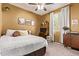 Cozy bedroom with a desk area, neutral decor, and a large window for natural light at 6413 S 47Th Dr, Laveen, AZ 85339