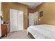 Bright bedroom with a closet, a double bed and a view of the adjoining room at 6413 S 47Th Dr, Laveen, AZ 85339