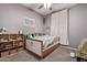 Neutral-toned bedroom with cute decor and stylish, -friendly furniture and soft, comfy carpeting at 6413 S 47Th Dr, Laveen, AZ 85339