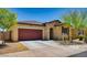 Charming single-story home featuring a tile roof, two-car garage, and inviting front yard landscaping at 6413 S 47Th Dr, Laveen, AZ 85339