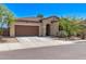 Charming single-story home with a tile roof, desert landscaping, and a two-car garage at 6413 S 47Th Dr, Laveen, AZ 85339