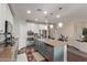 Spacious kitchen with a large island, stainless steel appliances, and modern cabinetry at 6413 S 47Th Dr, Laveen, AZ 85339