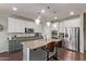 Modern kitchen with granite countertops, stainless steel appliances, and ample cabinet space at 6413 S 47Th Dr, Laveen, AZ 85339