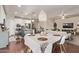Open concept kitchen and dining area with modern appliances and stylish pendant lighting at 6413 S 47Th Dr, Laveen, AZ 85339