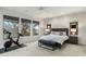 Well-lit bedroom with large windows and neutral decor, perfect for relaxation at 6929 E Montreal Pl, Scottsdale, AZ 85254