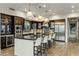 Modern kitchen with a large island, pendant lighting, stainless steel appliances, and custom cabinets at 6929 E Montreal Pl, Scottsdale, AZ 85254