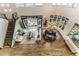 A high-angle view of a living room leading to an outdoor patio with a fire pit and an adjacent dining room at 6929 E Montreal Pl, Scottsdale, AZ 85254