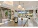 Bright living room featuring golf course views, a large sectional, and access to the patio at 6929 E Montreal Pl, Scottsdale, AZ 85254