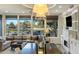 An open-concept living space with an integrated kitchen island and views of the golf course at 6929 E Montreal Pl, Scottsdale, AZ 85254