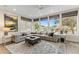 Inviting living room with large windows offering golf course views and a spacious seating area at 6929 E Montreal Pl, Scottsdale, AZ 85254