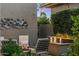 Outdoor patio featuring a cozy seating area with a fire pit and water feature, creating a relaxing atmosphere at 6929 E Montreal Pl, Scottsdale, AZ 85254