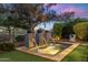 Inviting backyard pool with integrated fountains and picturesque landscaping at 6929 E Montreal Pl, Scottsdale, AZ 85254