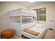 bedroom featuring a triple bunk bed, laminate floors and natural lighting at 7412 S Elm St, Tempe, AZ 85283