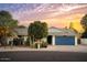 Charming single story home featuring a large driveway and a two car garage with lush landscaping at 7412 S Elm St, Tempe, AZ 85283