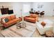 Bright and airy living room with stylish furniture, decor, and wood-style flooring at 7412 S Elm St, Tempe, AZ 85283